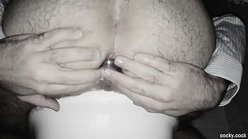 Play Russian gay ass stretching and stuffing while sitting on the toilet